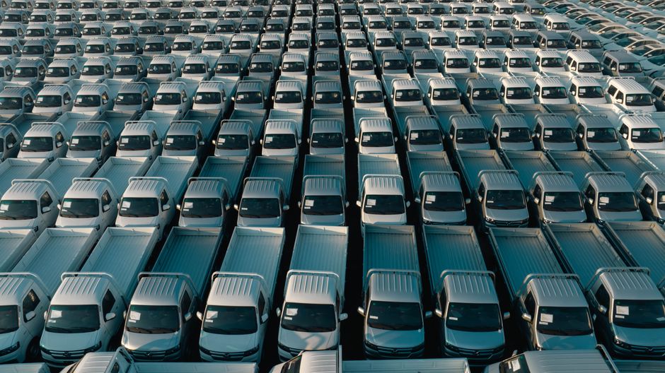 Fleet of white pickup trucks