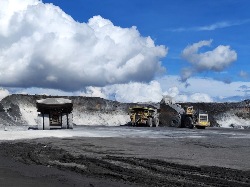 Utility trucks at a mining site